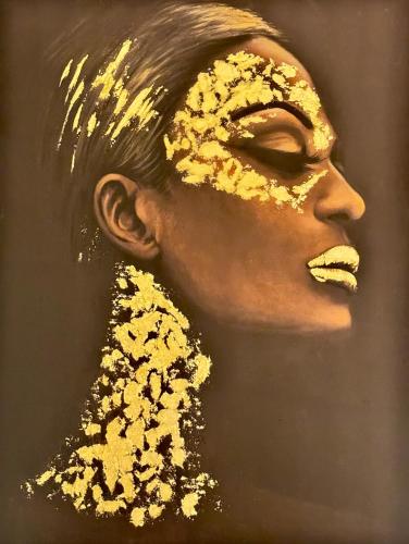 a painting of a woman with gold paint on her face at VILLA Ti-Colibri in Sainte-Anne