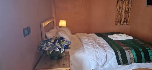 Postel nebo postele na pokoji v ubytování Bio Palace Hotel