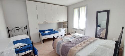 Ένα ή περισσότερα κρεβάτια σε δωμάτιο στο Appartamenti Enrica