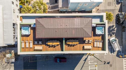 an overhead view of a building with tables and chairs at The Chateau - By Charleston Vacays in Charleston