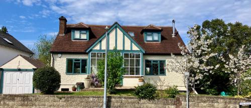 a white house with a brown roof at Homely holiday house in central Sevenoaks in Kent