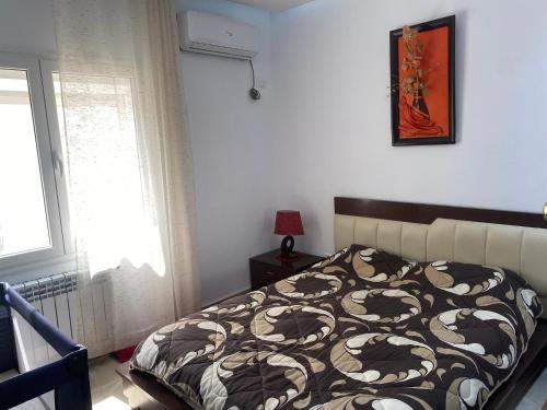Postel nebo postele na pokoji v ubytování City Apartment Rades Tunis free Wifi
