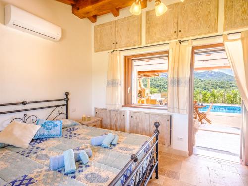 Postel nebo postele na pokoji v ubytování Sardinia Family Villas - Anita & Chanel with private pool
