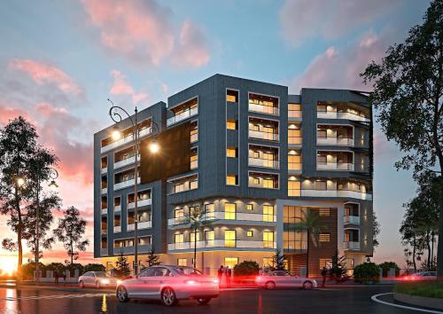 a building with cars parked in front of it at Lux Haven 2-Bedroom Apartment - Prime Location & Modern Comfort Near Gulberg in Lahore