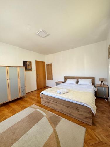 a bedroom with a large bed in a room at L's Apartment in Ohrid