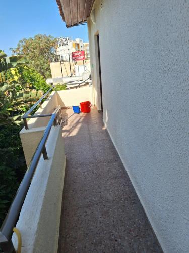 a stairway leading up to a white building at Big house in center of protaras, near beach in Protaras
