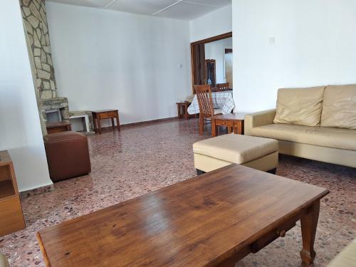 a living room with a couch and a coffee table at Big house in center of protaras, near beach in Protaras