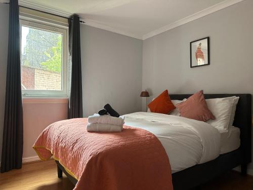 a bedroom with a bed with a teddy bear on it at Private Main Door Lovely 2 bedroom apartment in Edinburgh
