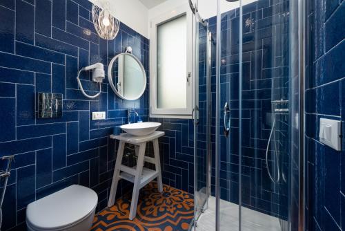 Et badeværelse på VOGLIA D'ESTATE apartments