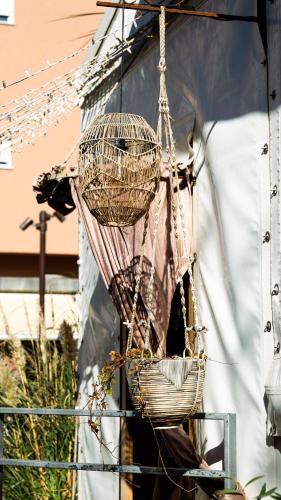 a basket hanging from the side of a building at Americana Beach House in Rimini