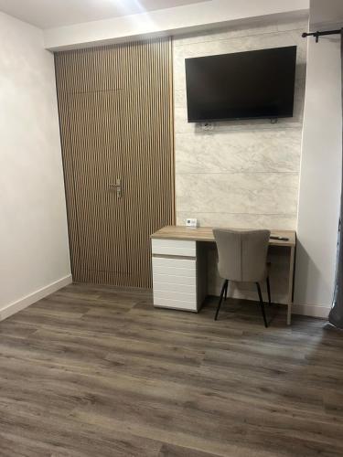 Μια τηλεόραση ή/και κέντρο ψυχαγωγίας στο Apartament Negris New