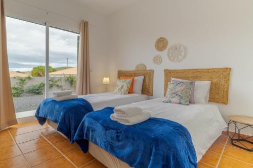 En eller flere senge i et værelse på Casa Mieiro - Porto Santo