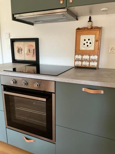 a kitchen with a stove and a counter top at Villa Bella Vita in Seeboden