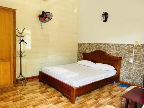Postel nebo postele na pokoji v ubytování Khách sạn Xuân Trúc