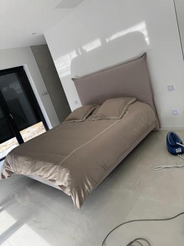 Un ou plusieurs lits dans un hébergement de l'établissement Villa beat