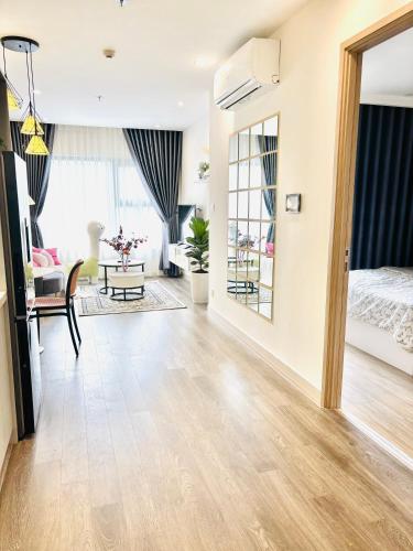 an open living room with a bed and a living room at Thỏ homestay in Gia Lâm Pho