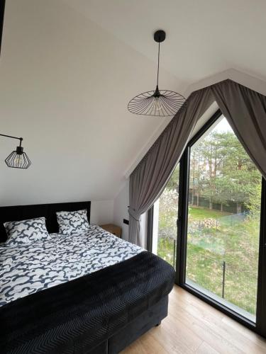 Ένα ή περισσότερα κρεβάτια σε δωμάτιο στο Apartamenty JAMAR