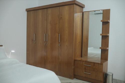 Ein Bett oder Betten in einem Zimmer der Unterkunft The Kayal Delight