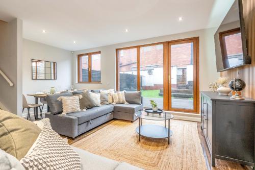 a living room with a couch and a table at Grovefield Getaway in Belfast