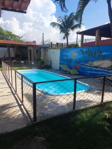 a swimming pool with aicrobialicrobialicrobialicrobialicrobialicrobialicrobialicrobialicrobialicrobialicrobial at Aloha Kite House in Lagoinha