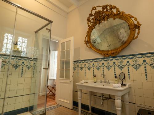 a bathroom with a sink and a mirror on the wall at Villa Barranco by Ananay Hotels in Lima