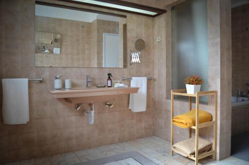 a bathroom with a sink and a mirror at SANTA RITA Guesthouse B&B in Vila Nova de Gaia