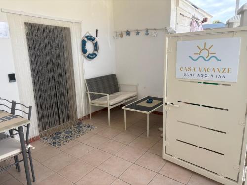 a room with a door with a sign on it at Casa vacanze Santiago e Ian in Maruggio