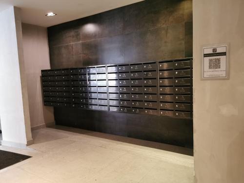 a wall with a bunch of lockers in a building at AGROWTH at Aru Suites in Kota Kinabalu