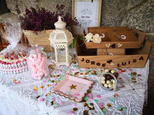a table topped with lots of toys and boxes at Casa Da Urcela in Ponteareas