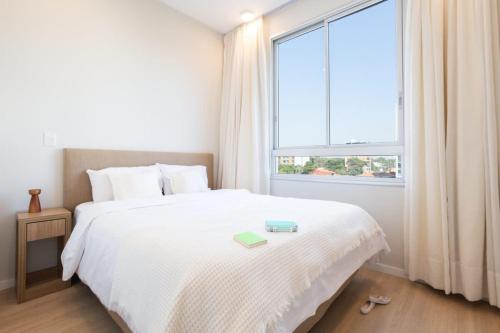 Una cama o camas en una habitación de Hestia at Asuncion Cozy & Bright 1BDR II