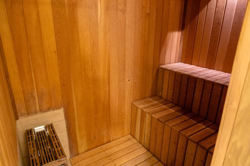 an inside view of a sauna with a wooden floor at Champet Boutique Hotel in Campos do Jordão