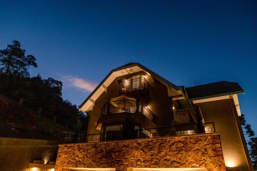 a building with a balcony on top of it at Champet Boutique Hotel in Campos do Jordão