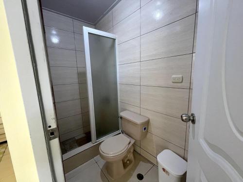 a small bathroom with a toilet and a mirror at Apartamento Costero 2 en Las Galeras in Las Galeras