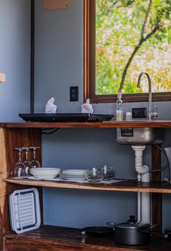 a kitchen counter with a sink and a window at Finca Murillo in Monteverde Costa Rica