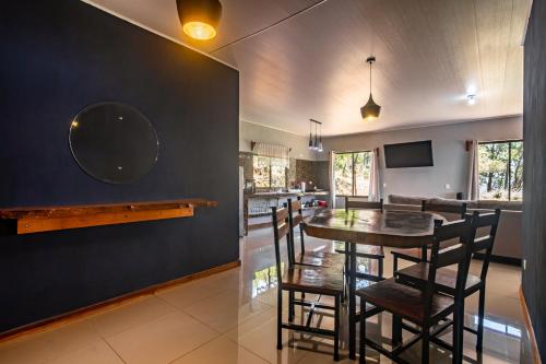 a kitchen and dining room with a table and chairs at Finca Murillo in Monteverde Costa Rica