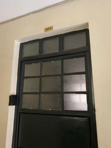 an exit sign above a door in a building at Lux Suites Cavendish Square Apartments in Syokimau