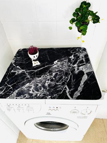 a black marble counter top in a bathroom at Esparta Home ! in Córdoba