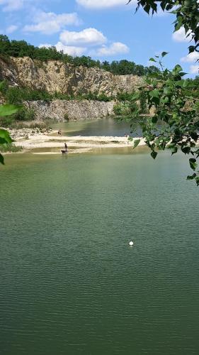 a body of water with people on the beach at Apartmány Lavander Mikulov in Mikulov