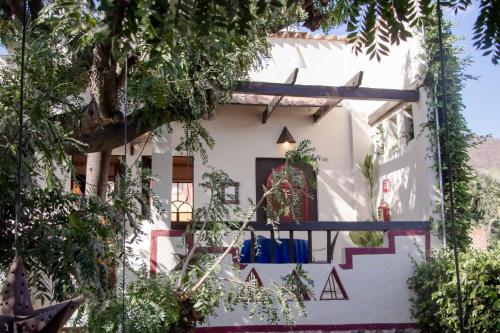a white house with a staircase in front of it at Hotel Casa Blanca in Ajijic