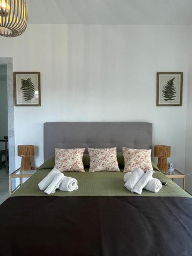 a bedroom with a large bed with pillows on it at Sweet relax del Gari 3-1 in Cassino