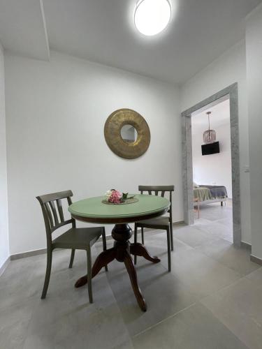 a dining room with a table and two chairs at Sweet relax del Gari 3-1 in Cassino