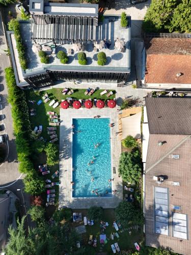 an overhead view of a swimming pool in a resort at Hotel CampingPark Steiner in Laives