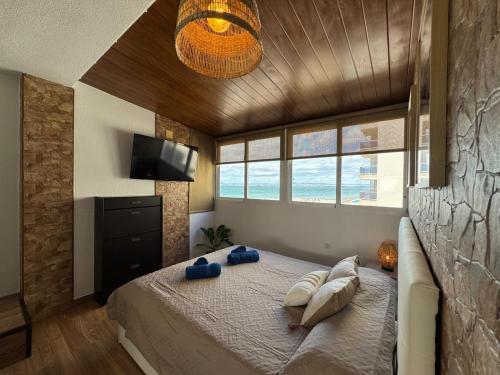 a bedroom with a bed with two pillows on it at Chalet en Mar Menor Urb las Góndolas in La Manga del Mar Menor