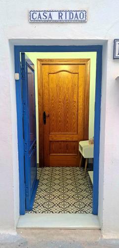 an open door to a room with a wooden door at Casa Ridao-Habitación Indalo con vistas in Mojácar