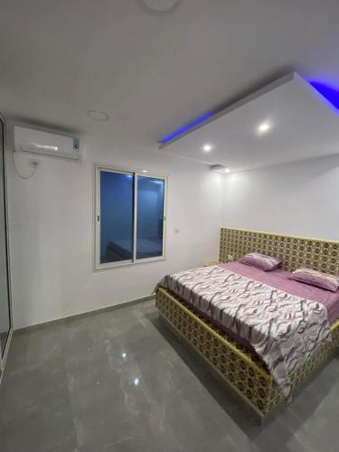 Llit o llits en una habitació de قليبية