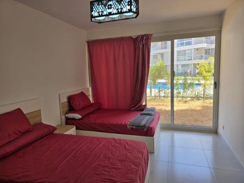 Postel nebo postele na pokoji v ubytování Marassi marina west