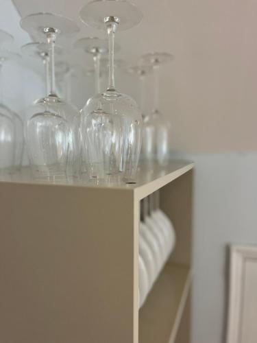 a group of wine glasses sitting on a shelf at Casa das Flores Leiria Silvercoast Portugal in Monte Redondo