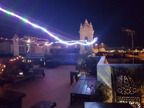 a building with lights on it at night at El Beaterio Apartments in Tarifa