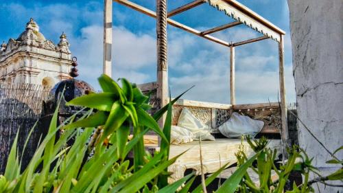 a hospital bed with a tower in the background at El Beaterio Apartments in Tarifa