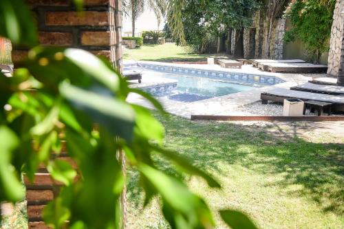a swimming pool in the yard of a house at Complejo Costa Marina in Miramar